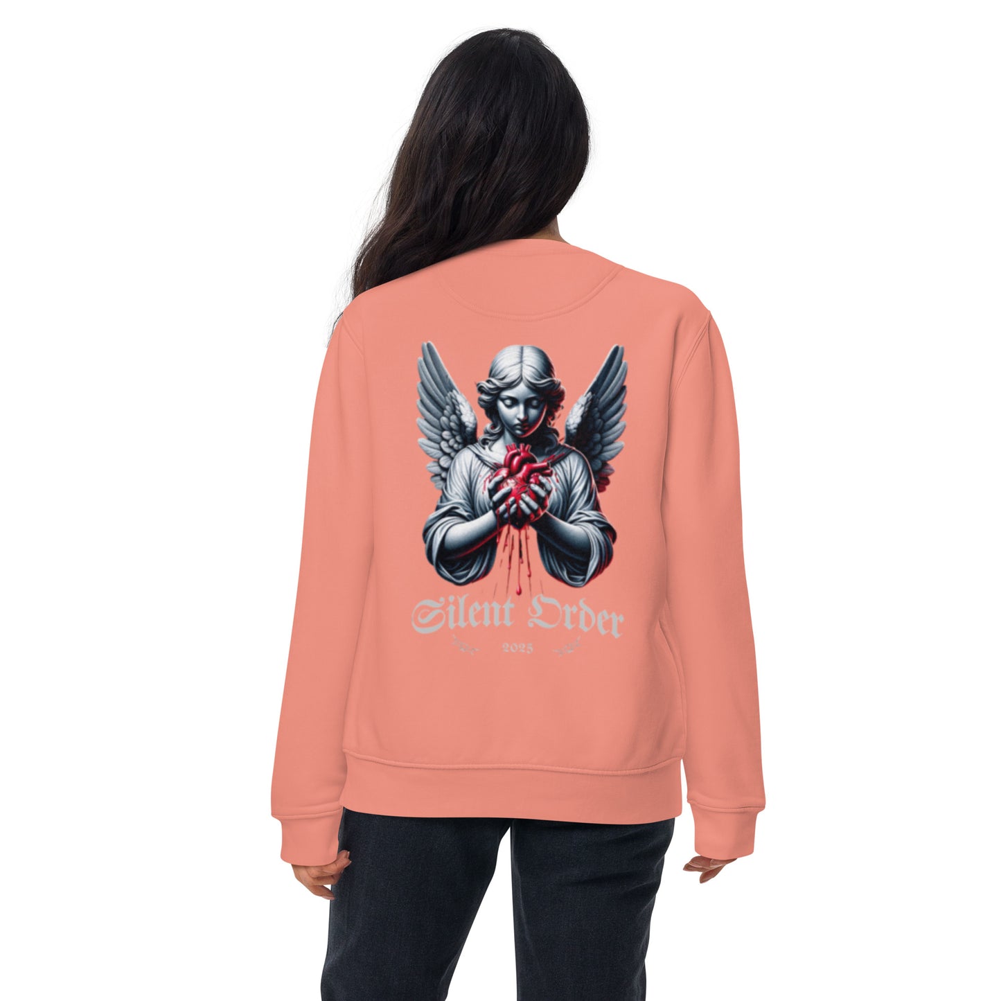 Person wearing a peach sweatshirt with an angel graphic and 'Silent Order' text on the back.