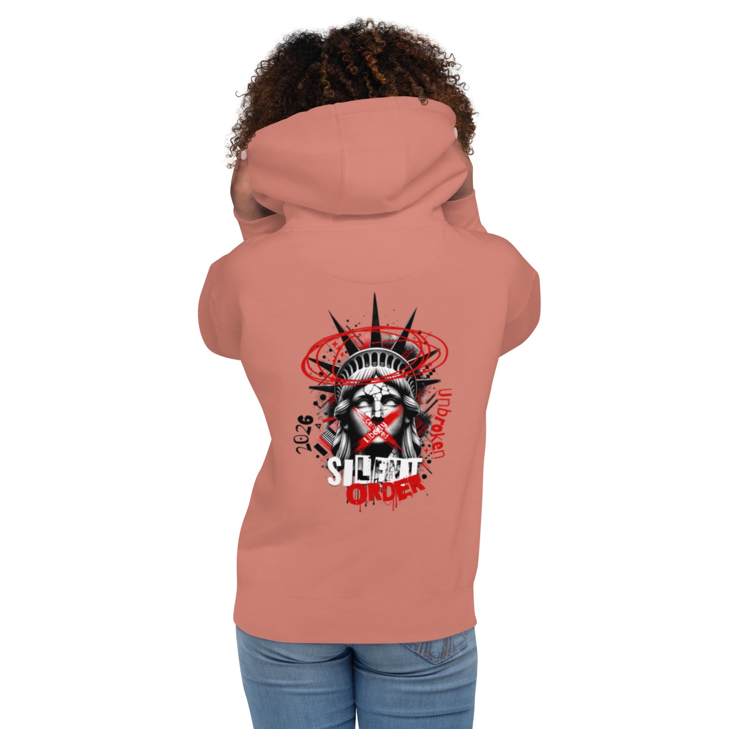 Person wearing a peach hoodie with a graphic design on the back, standing against a white background.