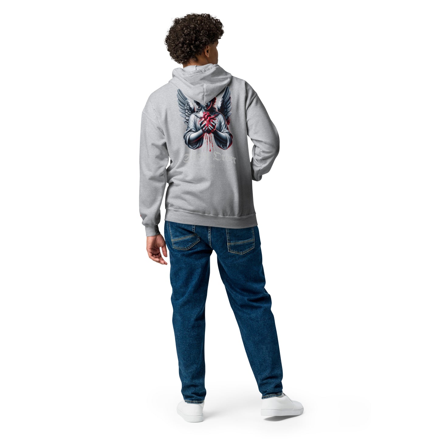 Person wearing a gray hoodie with a graphic design on the back, standing against a white background
