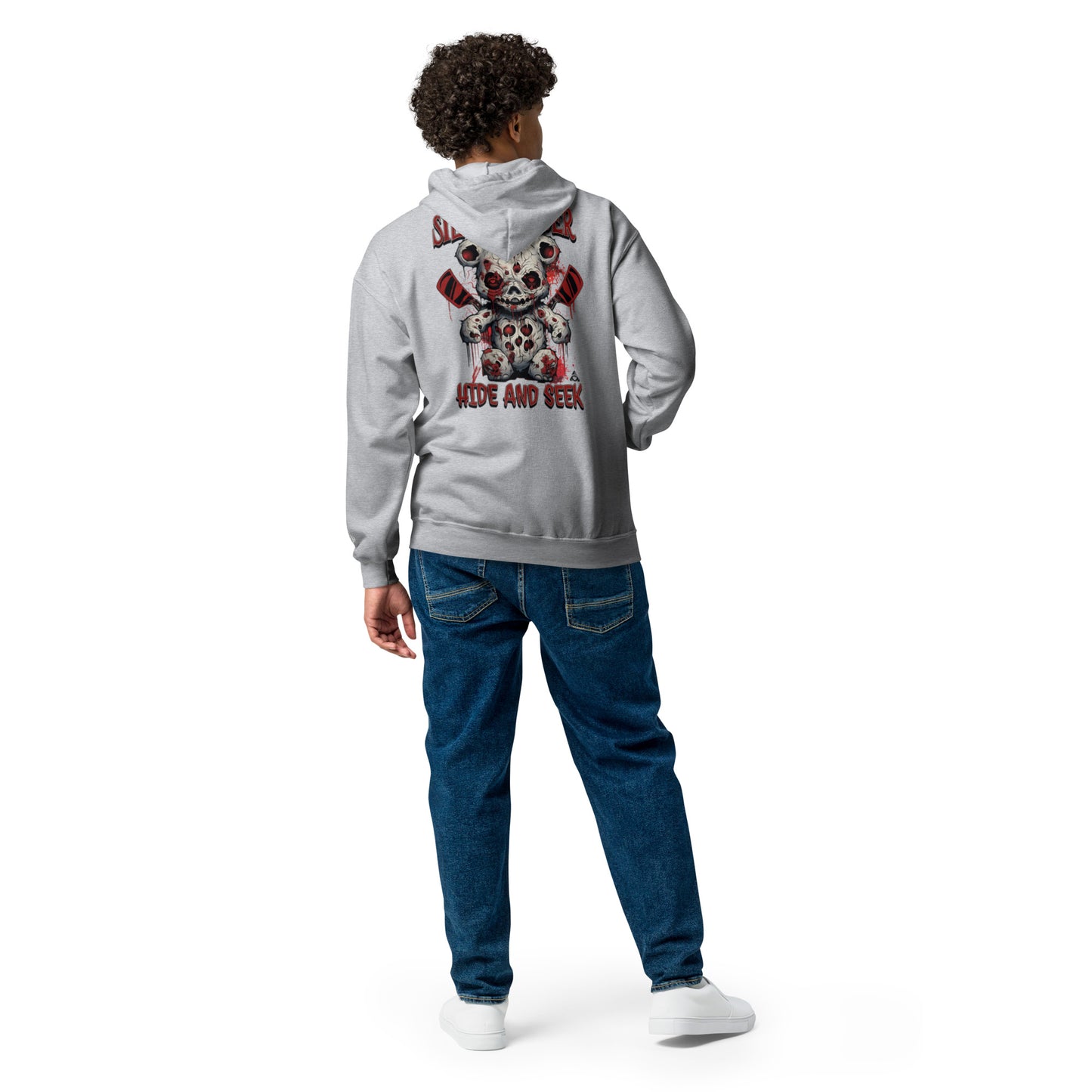Person wearing a gray hoodie with a colorful design on the back, standing against a white background
