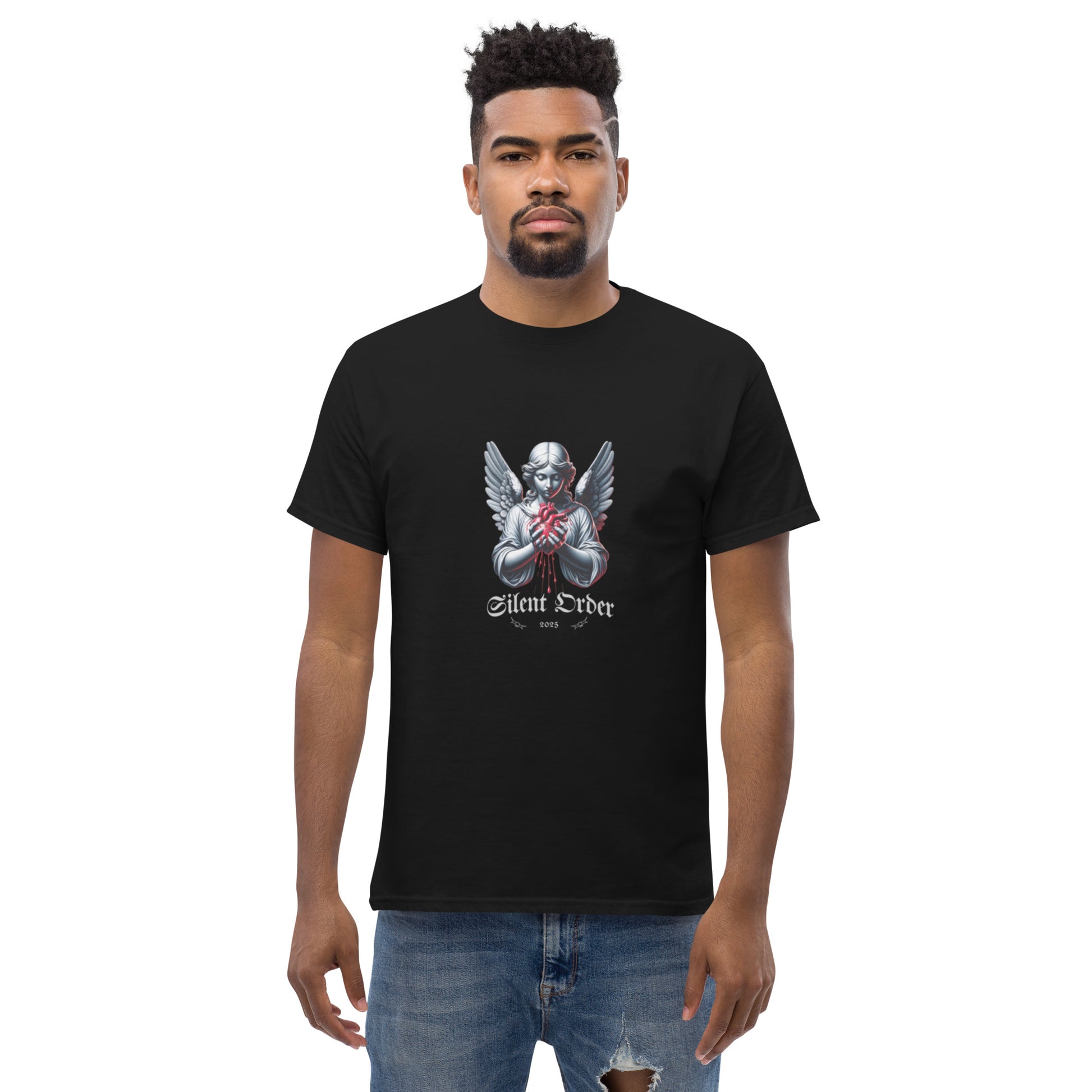 Man wearing a black t-shirt with a graphic design on a white background
