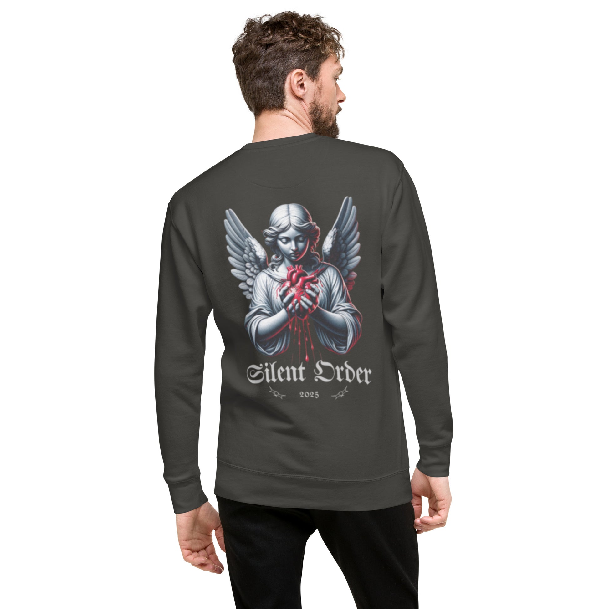 Man wearing a dark gray sweatshirt with an angel graphic and 'Silent Order' text on the back.