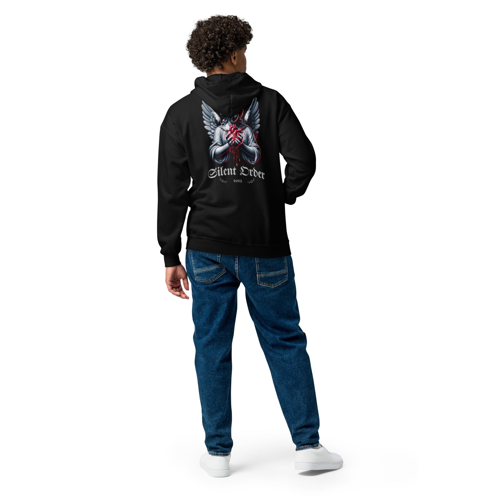 Person wearing a black hoodie with a design on the back, standing against a white background