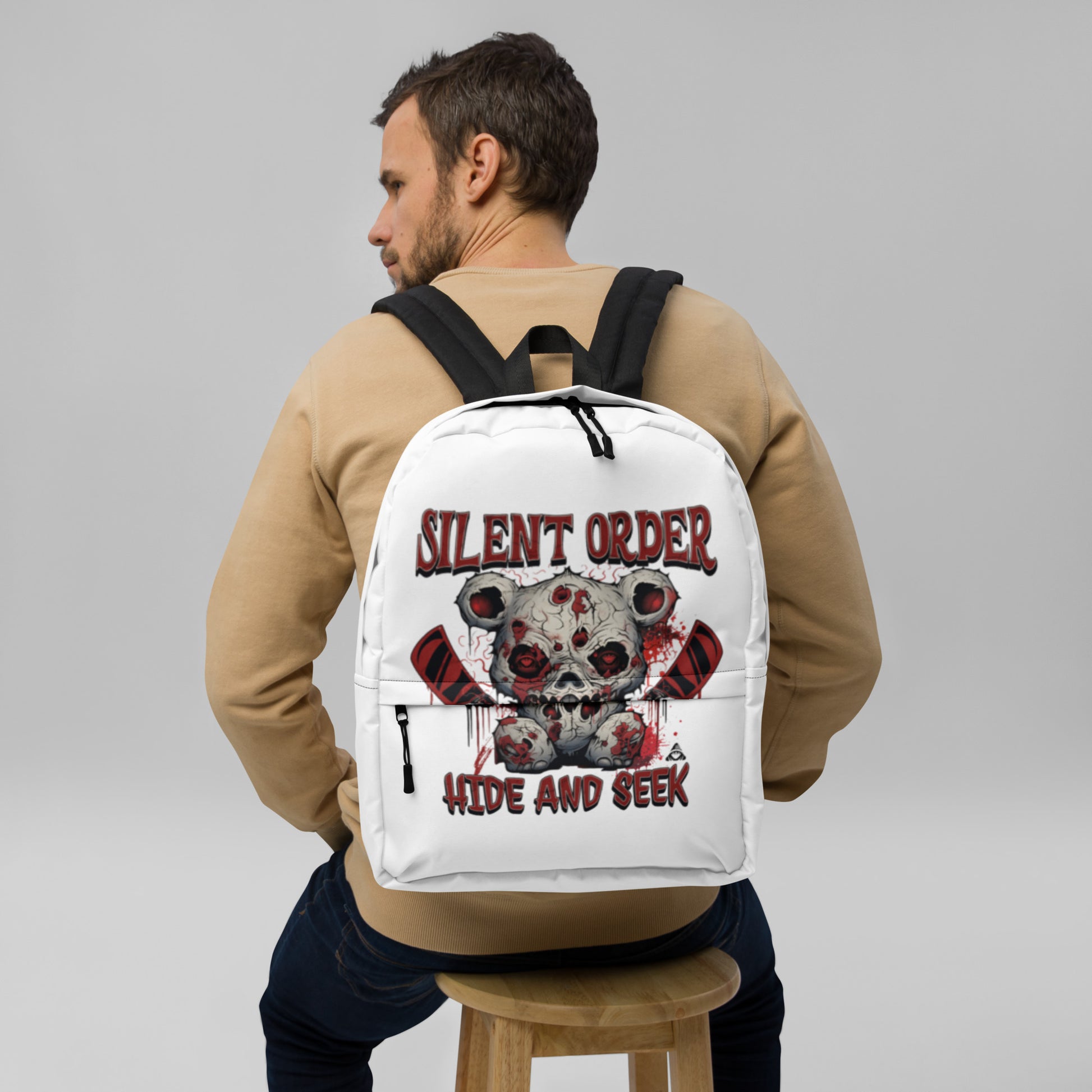 Person wearing a white backpack with 'Silent Order' design on a gray background