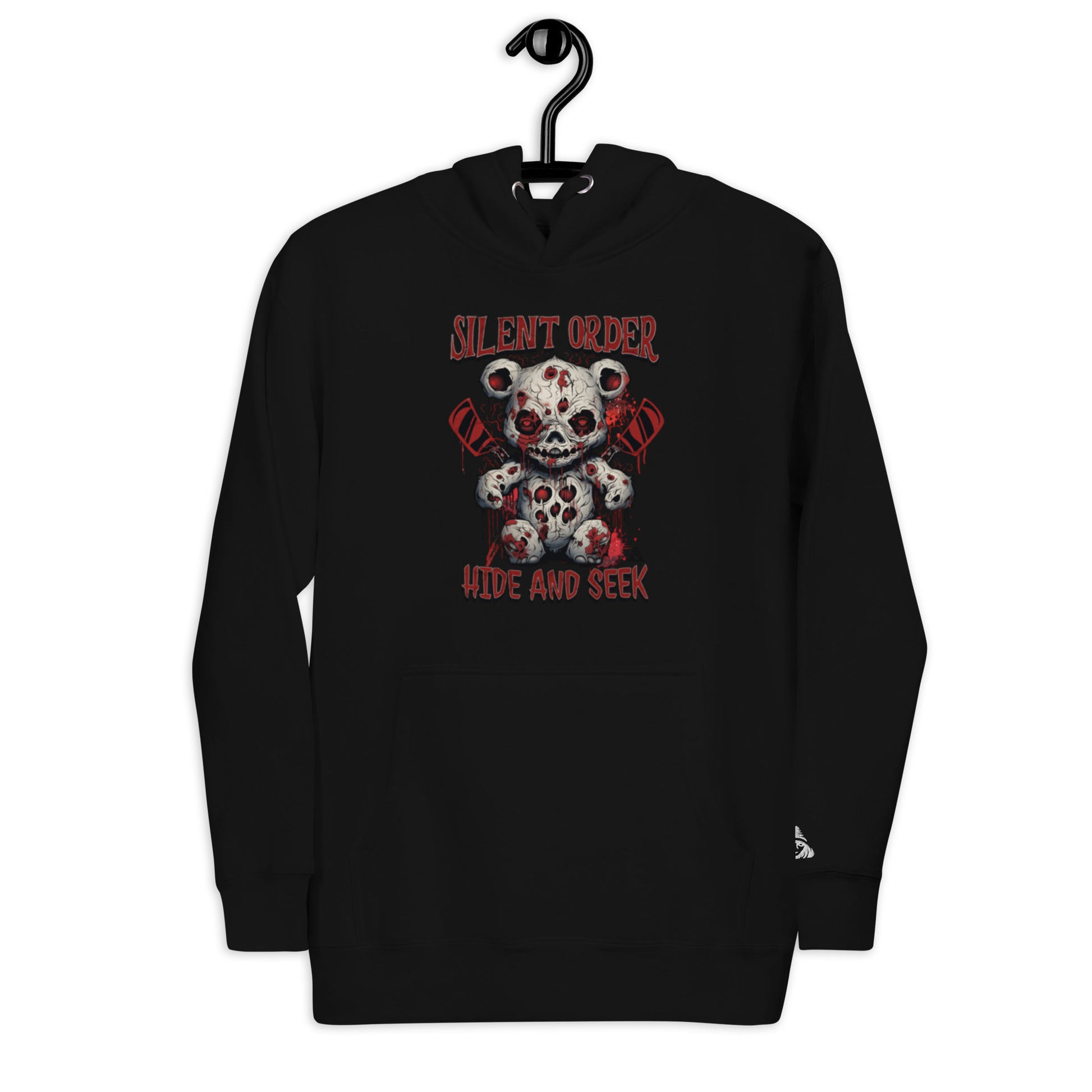 Black hoodie with a graphic design of a teddy bear and text on a hanger against a white background