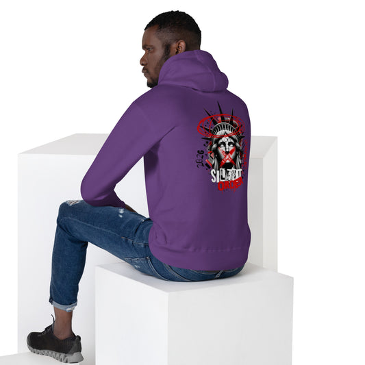 Person wearing a purple hoodie with a graphic design on the back, sitting on a white cube.