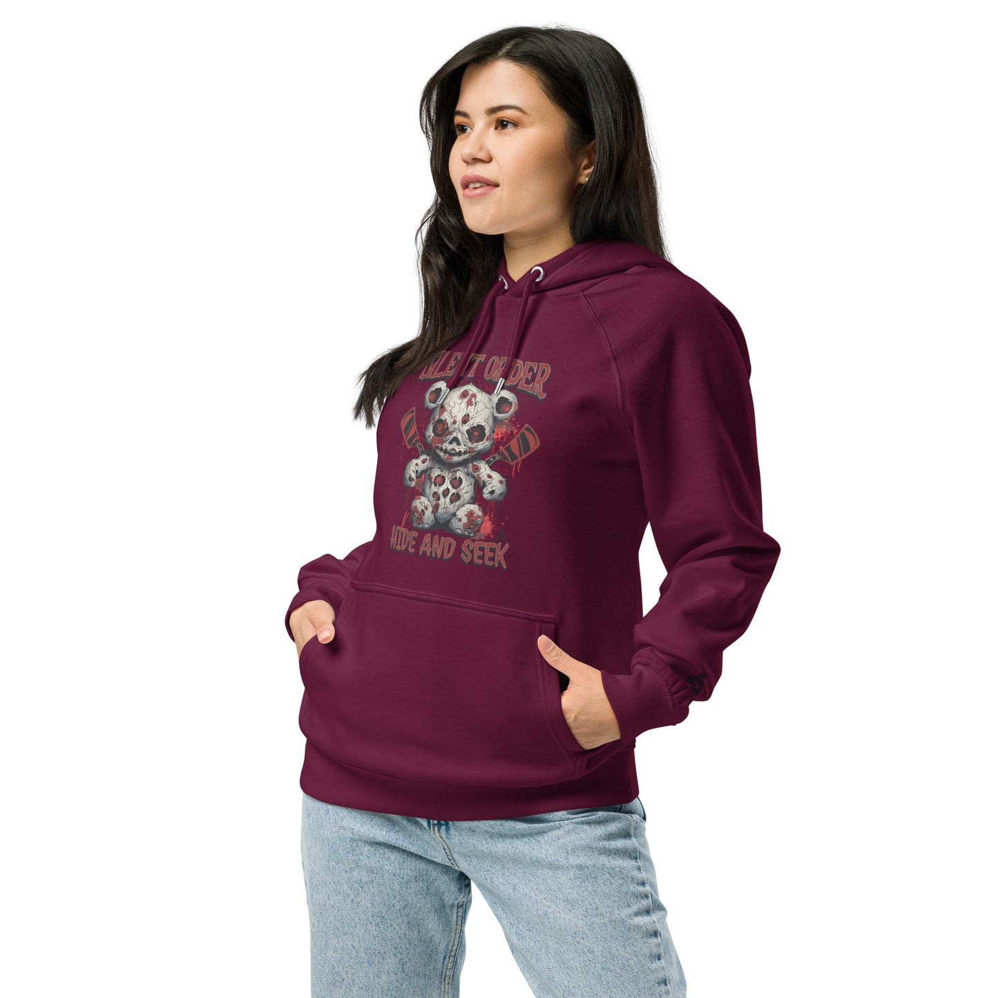 Woman wearing a maroon hoodie with a graphic design on a white background