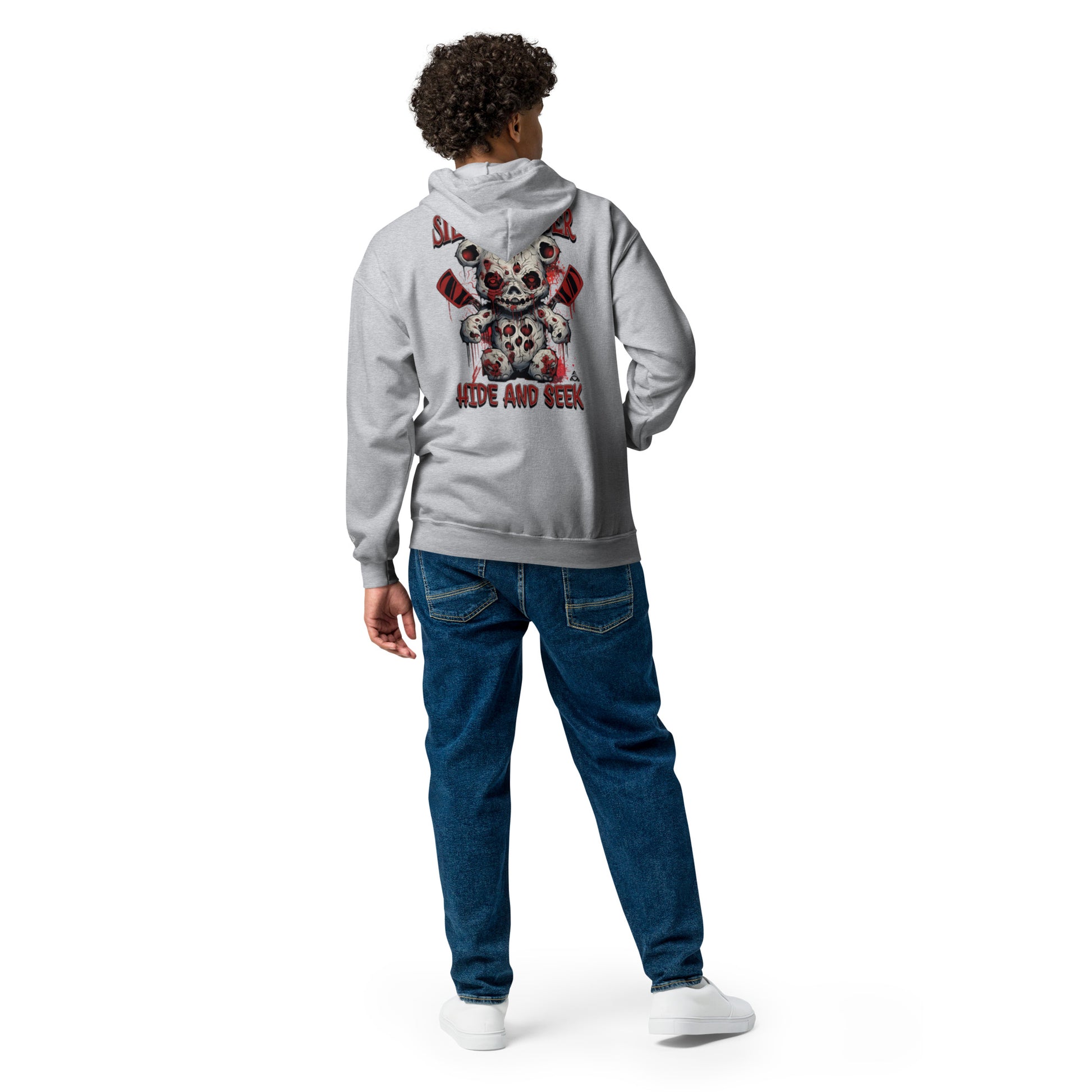 Person wearing a gray hoodie with a colorful design on the back, standing against a white background