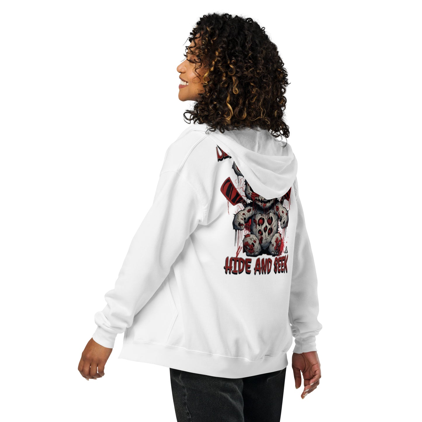 Person wearing a white hoodie with a graphic design on the back, standing against a white background