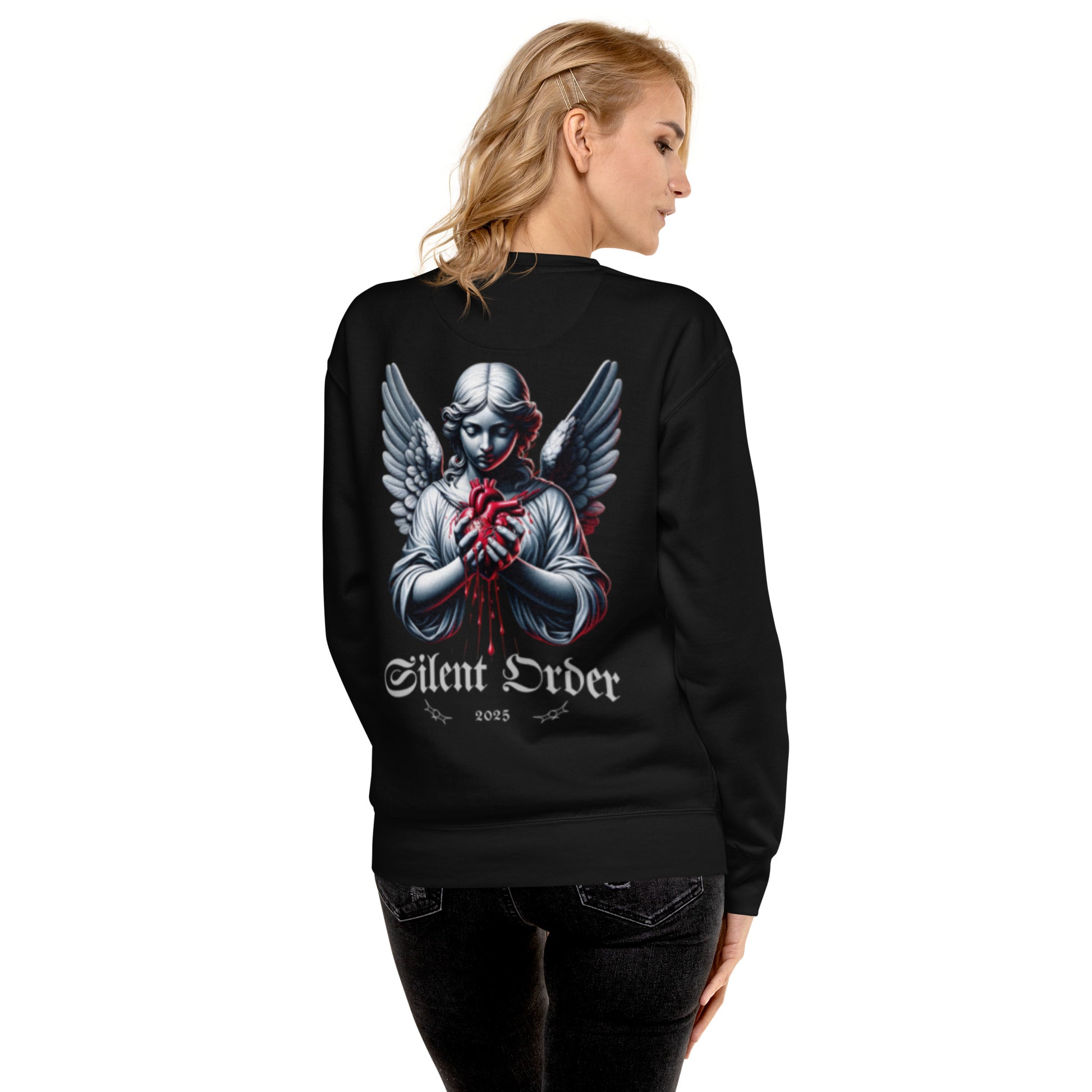 Person wearing a black sweatshirt with an angel design and 'Silent Order' text on the back.