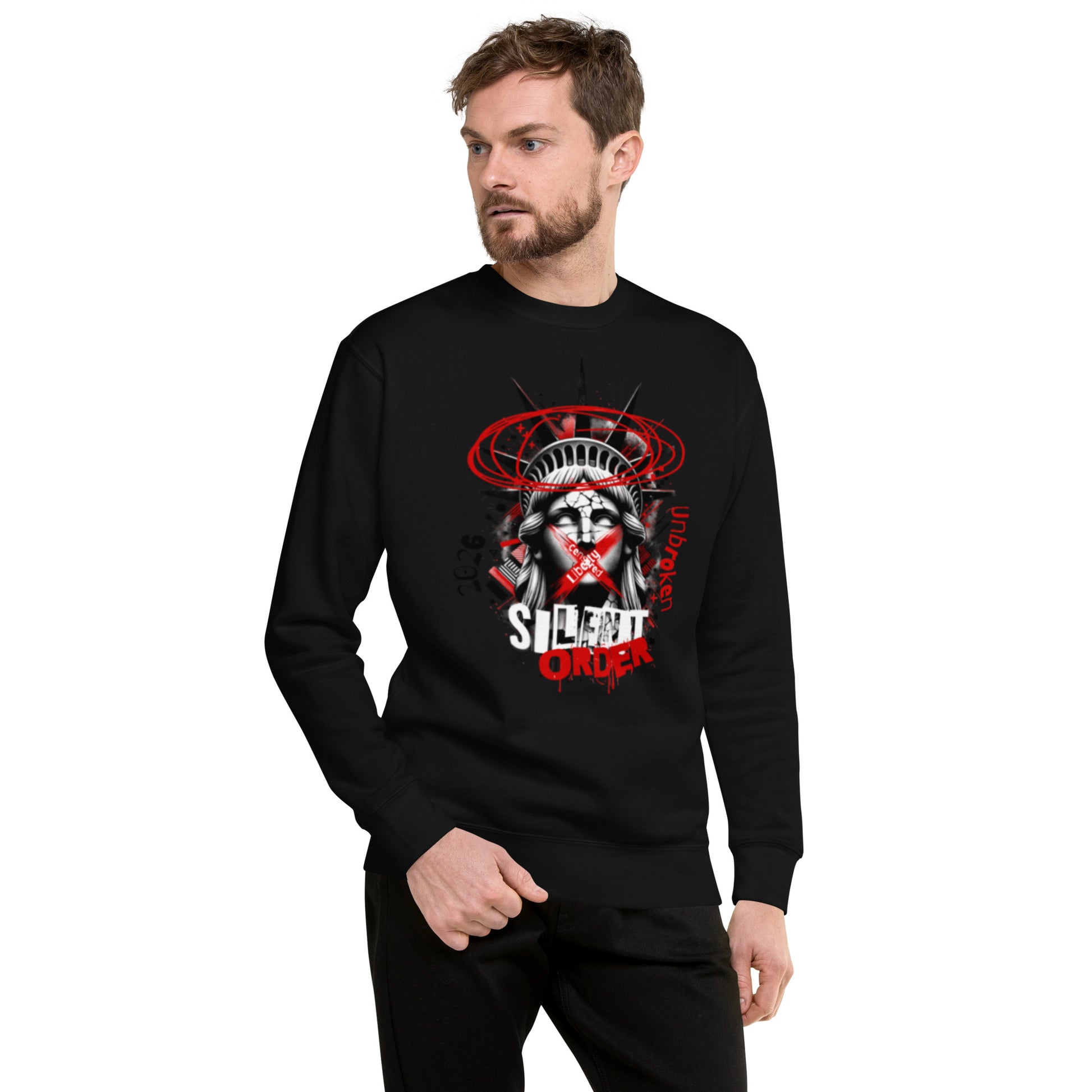 Man wearing a black long-sleeve shirt with a graphic design on a white background