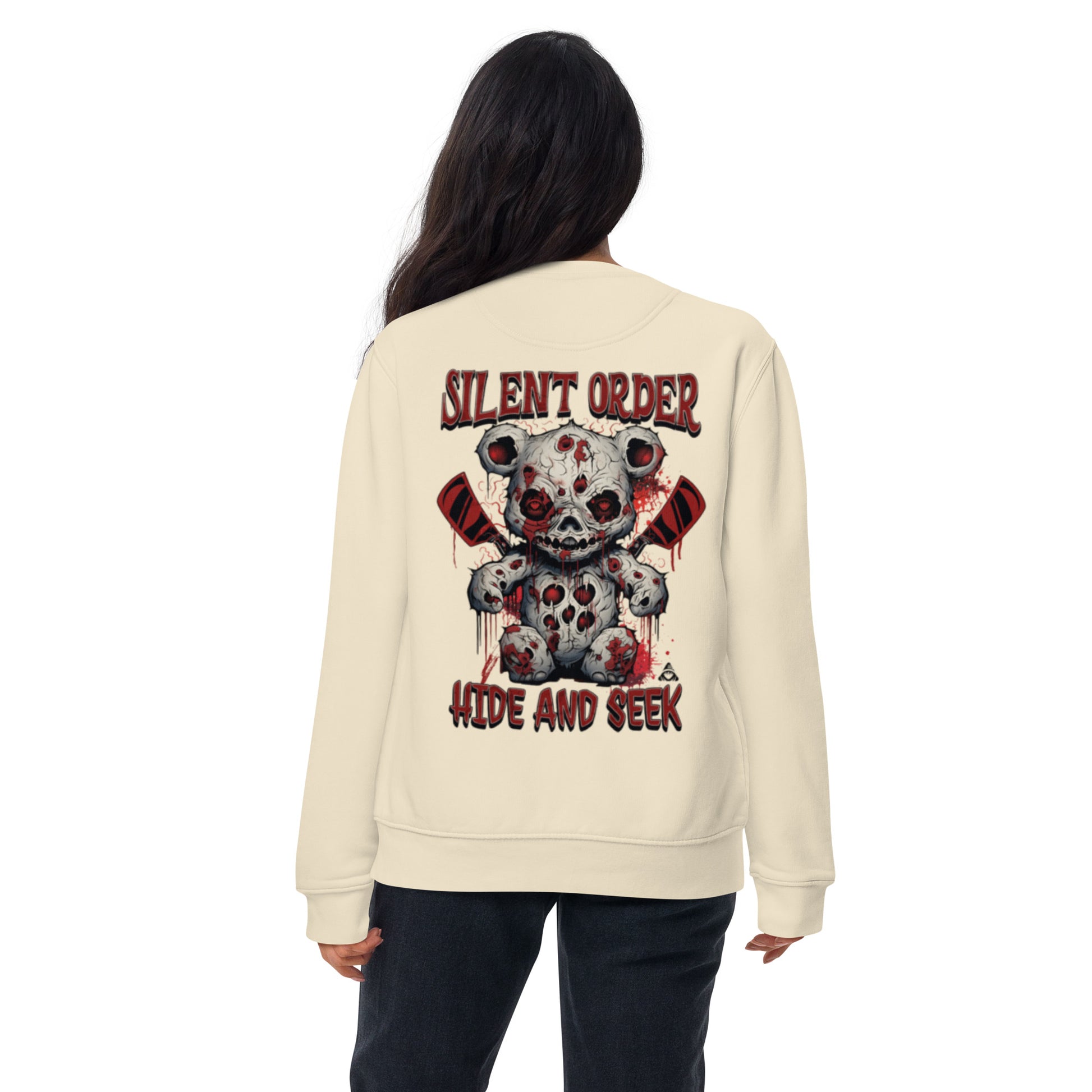 Beige sweatshirt with graphic design and text on the back, worn by a person.