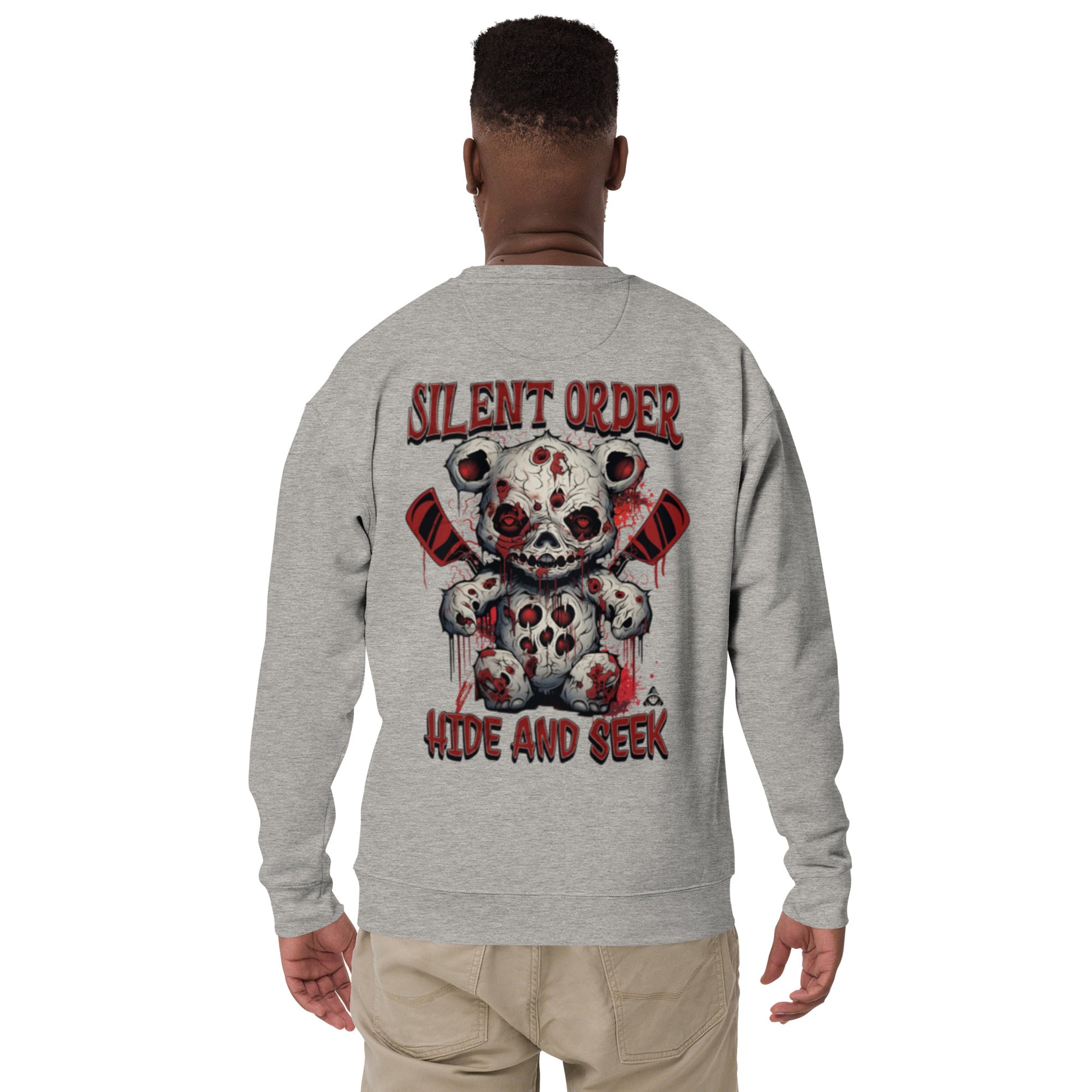 Gray sweatshirt with a graphic design and text on the back, worn by a person.